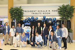 Group photo in the President Gerald R. Ford Tribute Room with the airport mascot