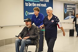 Honor Flight veterans being welcomed and escorted through the terminal