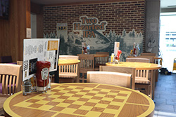 Restaurant table setting featuring Two Hearted IPA branding in an airport dining area