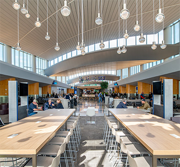 Concourse A with travelers in lobby. Aletidude can be seen in the background.